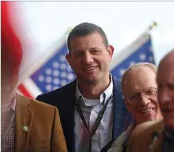  ?? ?? Rep. David Valadao, R-Hanford, smiles as his colleagues speak during a news conference at Tuesday’s World Ag Expo in Tulare.