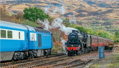  ?? SAM YEELES ?? The Midland Pullman visited Fort William on October 23, followed by a day trip to Mallaig on the 24th, and returning south on the 25th. Believed to be the first time a High Speed Train set has visited Mallaig, it is pictured at Arisaig passing LMS ‘Black Five’ No. 45407, heading the ‘Jacobite’ on October 24. The Midland Pullman is set to return to the West Highland Line in 2022.