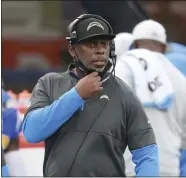  ?? PETER JONELEIT — THE ASSOCIATED PRESS, FILE ?? Chargers head coach Anthony Lynn calls in a play against the Falcons on Sunday in Inglewood.