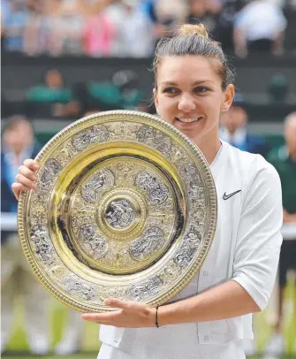  ?? Picture: AFP ?? Simona Halep takes the prize after demolishin­g Serena Williams.