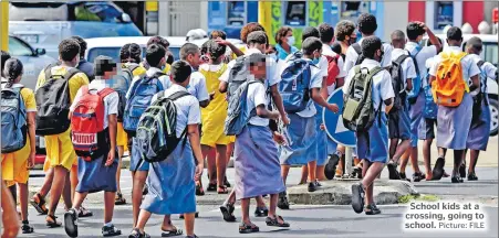  ?? Picture: FILE ?? School kids at a crossing, going to school.