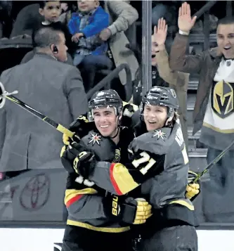  ?? ETHAN MILLER/GETTY IMAGES ?? A hat is tossed onto the ice as Reilly Smith, left, of the Vegas Golden Knights, celebrates with William Karlsson after Karlsson scored his third goal of the game against the Toronto Maple Leafs in the third period of their game at T-Mobile Arena, on...