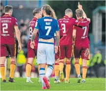  ?? ?? Top: Saints players celebrate their goal. Above: Well’s Blair Spittal points the way after his equaliser.