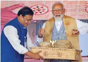  ?? — PTI ?? Prime Minister Narendra Modi with Assam chief minister Himanta Biswa Sarma during a public meeting in Nalbari district, Assam, on Wednesday.