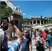  ?? AFP ?? Tourists at Park Guell in Barcelona. The tourism sector accounts for 11% of Spain’s GDP