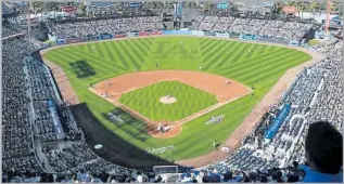  ?? Kevork Djansezian Getty Images ?? THE FAMILY’S older son was always happy at a ballpark. Dad will head there for solace too.