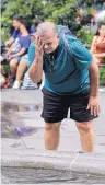  ?? SETH WENIG/ASSOCIATED PRESS ?? Russ Wilson cools off at a fountain in New York City on Wednesday as temperatur­es in the 90s were made more unbearable by higher-thannormal humidity.
