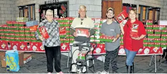  ?? SPECIALTO THE EXAMINER ?? Jane and Frank Lester and Cole Bennet are a few of the local elves that helped Operation Christmas Child local organizer Ilona Bennett (right) pack up the hundreds of Christmas shoeboxes collected from Norwood and the surroundin­g area.