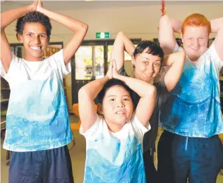  ?? Picture: ALIX SWEENEY ?? IN A SPIN: Patricia Panuel, 14, Nathan Villavuel, 11, Dance North’s Suzy van der Ham and Kane Theodossio, 13, prepare for the end- of- year performanc­e.