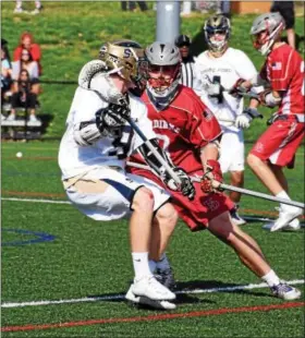  ?? ANNE NEBORAK — DIGITAL FIRST MEDIA ?? Spring-Ford’s Kevin Todd holds onto the ball as Upper Dublin’s Henry Winebrake tries to stop him on Saturday at the Katie Samson Festival.