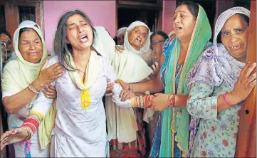  ??  ?? The family of slain 20yearold soldier Satish Bhagat cry at their Jammu residence on Thursday. Bhagat and Lance Naik Ranjit Singh were killed in Pakistan’s sniper fire along the Line of Control in Kupwara on Wednesday. PTI