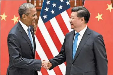  ??  ?? SAUL LOEB/GETTY-AFP President Barack Obama and China’s Xi Jinping have officially committed their nations to a landmark global climate pact.