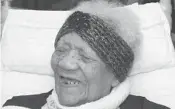  ?? APRIL FEAGLEY/AP 2107 ?? Delphine Gibson smiles during her 114th birthday party while in her bed in Huntingdon, Pa.