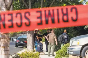  ?? Apu Gomes / AFP/Getty Images ?? FBI agents are collecting evidence at the home of suspected nightclub shooter Ian David Long in Thousand Oaks, northwest of Los Angeles, on Thursday. The gunman who killed 12 people in a crowded California country music bar has been identified as 28-year-old Ian David Long, a former Marine, the local sheriff said Thursday. The suspect, who was armed with a .45-caliber handgun, was found deceased at the Borderline Bar and Grill, the scene of the shooting in the city of Thousand Oaks northwest of downtown Los Angeles.