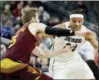  ?? ISAAC BREKKEN — ASSOCIATED PRESS ?? Arizona State’s Mickey Mitchell, left, covers a drive from Colorado’s George King during the second half of a first-round game in the Pac-12 Tournament in Las Vegas on March 7.