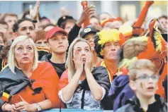  ??  ?? Belgium fans react as they watch the broadcast of the World Cup semi-final match between France and Belgium in the fan zone in Brussels, Belgium. — Reuters photo