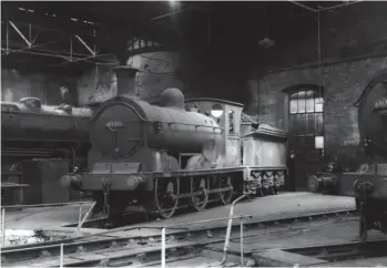  ?? Chris Bush Collection, courtesy The Engine Shed Society ?? Resident in the roundhouse during 1956 is Holmes ‘J36’ No 65216 Byng. Called Byng because of its military service to the Western Front in World War I, the engine was named after Field Marshal The Right Honourable, The Viscount Byng of Vimy, GCB, GCMG, MVO, Commander of the Canadian Corps at the Battle of Vimy Ridge, April 1917. Cowlairs-built in January 1890, this 0-6-0 arrived on the Canal shed allocation in May 1942, and after 14½ years it would be transferre­d away to
Polmadie, in December 1956, and later to Kipps, from where it left service on 30 April 1962 to be cut up by McLellan’s of Langloan. Byng sits on one of the two north-side roundhouse roads that survived the 1910 building modificati­on to allow a pair of parallel tracks to enter – they are seen behind, with an Ivatt ‘4MT’ Mogul at rest, and just in view on the near right is ‘N15’ 0-6-2T No 69174.