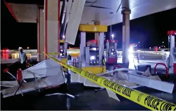  ?? KWTV via AP ?? ■ In this image made from video, debris from tornadoes pile around the pumps of a filling station late Sunday in Shawnee, Oklahoma. Several reported tornadoes ripped through Oklahoma late Sunday into early Monday morning, causing damage but no immediate word of deaths or injuries.