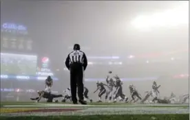  ?? CHARLES KRUPA, THE ASSOCIATED PRESS ?? It seems that most of the NFL games Sunday were played in a fog, not just the one that enveloped the New England Patriots-Atlanta Falcons game in Foxborugh, Mass.