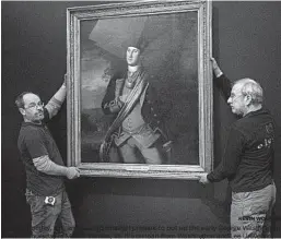  ?? KEVIN WOLF/AP ?? Dermot Rooney, left, and David Schlaegel prepare to put up the early George Washington portrait Thursday in Mount Vernon, Va. It’s on loan from Washington and Lee University.