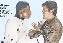  ??  ?? John Boyega and Oscar Isaac in “Star Wars: The Force Awakens.”