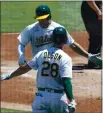  ?? ANDA CHU — BAY AREA NEWS GROUP, FILE ?? The A’s Matt Chapman celebrates with teammate Matt Olson (28) after scoring on a solo home run against the Rockies on July 29 at the Coliseum in Oakland.