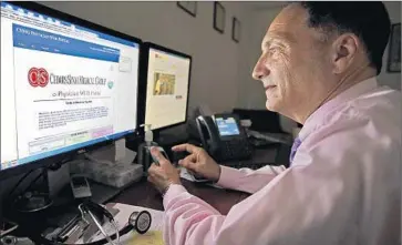  ?? Al Seib Los Angeles Times ?? VIEWING your medical records can help doctors better coordinate care, experts say. Above, Dr. Daniel Stone, with Cedars-Sinai Medical Group in Beverly Hills, logs into a system with access to a patient’s mobile app.