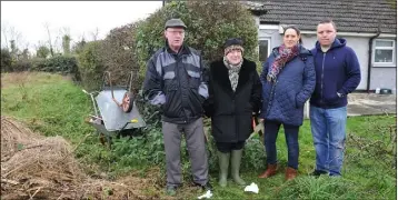  ??  ?? Peter, Margaret and Niamh Hughes together with Mark Daly at the area which was covered with raw sewage.