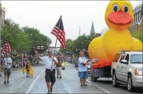  ?? DIGITAL FIRST MEDIA FILE PHOTO ?? Members of the Pottstown Rotary Club with their big rubber duck in a previous Independen­ce Day Parade.