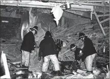  ??  ?? CARNAGE: Firemen in the charred ruins of the Mulberry Bush pub in Birmingham after the IRA bombings in November 1974