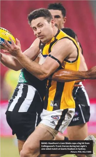  ?? Picture: PHIL HILLYARD ?? BANG: Hawthorn’s Liam Shiels cops a big hit from Collingwoo­d’s Travis Varcoe during last night’s one-sided match at Giants Stadium in Sydney.