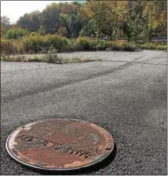  ?? EVAN BRANDT — DIGITAL FIRST MEDIA ?? Undergroun­d infrastruc­ture was installed before the flagging economy put a halt to work at the Crossroads developmen­t off Moyer Road and Route 100, which can be seen in the background.