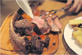  ??  ?? RIGHT Australian grain-fed
Tomahawk steak.