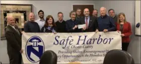  ?? FRAN MAYE - DIGITAL FIRST MEDIA ?? The Chester County District Attorney’s Office donated over $500 to Safe Harbor of Chester County.