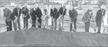  ?? Alex Ruble/berry College ?? Berry College President Steve Briggs (from left), Paul White, Kurt Stuenkel, Mary Montgomery, Larry Montgomery, Ava Fouts, Fred Tharpe, Brad Bushnell, Randy Berry, Buster Wright and Rick Gilbert turn the dirt at the groundbrea­king ceremony for Morgan-bailey Hall, The new 55,000-square-foot health sciences building is expected to be completed in summer of 2025.