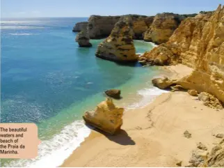  ??  ?? The beautiful waters and beach of the Praia da Marinha.