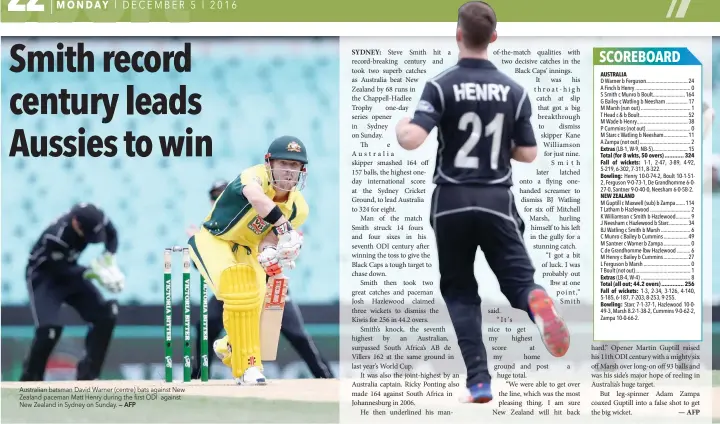  ?? — AFP ?? Australian batsman David Warner (centre) bats against New Zealand paceman Matt Henry during the first ODI against New Zealand in Sydney on Sunday.