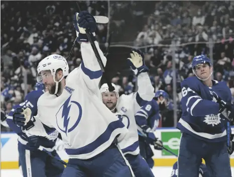  ?? FRANK GUNN/THE CANADIAN PRESS VIA AP ?? Tampa Bay Lightning defenseman Victor Hedman (77) celebrates his goal against the Toronto Maple Leafs with center Steven Stamkos (91) during the first period of Game 2 of an NHL hockey Stanley Cup playoffs first-round series on May 4 in Toronto.