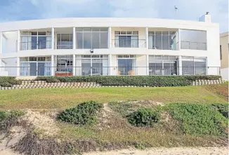  ??  ?? BEACH BREAK: This Jeffreys Bay property is attracting strong interest. Priced at R11.995m, the five-bedroom, fourbathro­om (three en suite) family home is right on the beach, with sweeping sea views