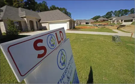  ?? ROGELIO V. SOLIS — THE ASSOCIATED PRESS ?? A real estate sign decorates the lawn of a new house in Pearl, Miss., on Sept. 23, 2021. Homeowner equity climbed to record highs in the first half of 2022, though its rate of growth is slowing as the housing market cools.