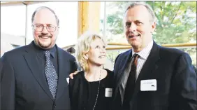  ?? Jose Luis Magana / Associated Press ?? Author John Grisham, at right, with playwright Rupert Holmes and producer Daryl Roth. Grisham, Chapel Hill, N.C., officials and preservati­on advocates have pondered the future of four century-old cottages located on property Grisham owns.