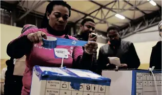  ?? ?? AN ELECTION official seals a ballot box as observers look on, at the end of the day’s voting during elections in Manenberg. Freedom is more than the right to vote and the repealing of pass laws , the writer says. | African News Agency (ANA) archives