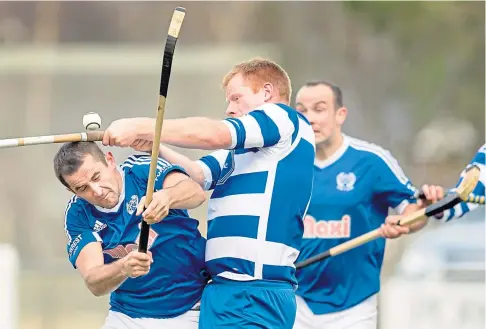  ??  ?? GOING STRONG: Newtonmore’s Jamie Robinson, centre, is looking forward to pre-season training but is saying no to friendlies