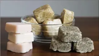  ?? HOLLY RAMER, THE ASSOCIATED PRESS ?? Three versions of handmade sugar scrub bars - a combinatio­n of exfoliatin­g sugar, moisturizi­ng oil and a bit of soap to hold it all together.
