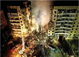  ?? ?? Destroyed: The nine-storey apartment block in Dnipro