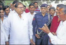  ??  ?? INLD candidate from Ellenebad Abhay Chautala during an election campaign at Arniawali village; and (right) BJP nominee Pawan Beniwal meeting voters at Budhi Meri village.