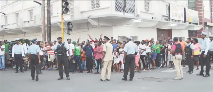  ??  ?? Supporters from APNU+AFC outside of the Region Four returning officer’s office yesterday afternoon during the controvers­y