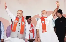  ?? PHOTO: PTI ?? Prime Minister Narendra Modi and BJP President Amit Shah at an election rally in Ahmedabad on Monday
