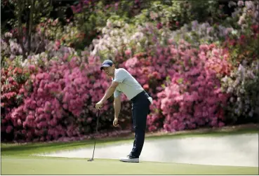  ?? CHARLIE RIEDEL — THE ASSOCIATED PRESS ?? McIlroy watches his putt on the 13th hole during a practice round for the 2019 Masters in Augusta, Ga.