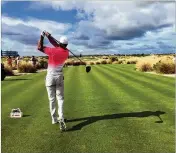  ?? DOUG FERGUSON / AP ?? Tiger Woods drives the green on the 350-yard seventh hole during Wednesday’s Hero World Challenge pro-am. Woods sank a 20-foot putt for eagle.